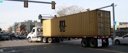 picture of large sized container truck on East First Street
